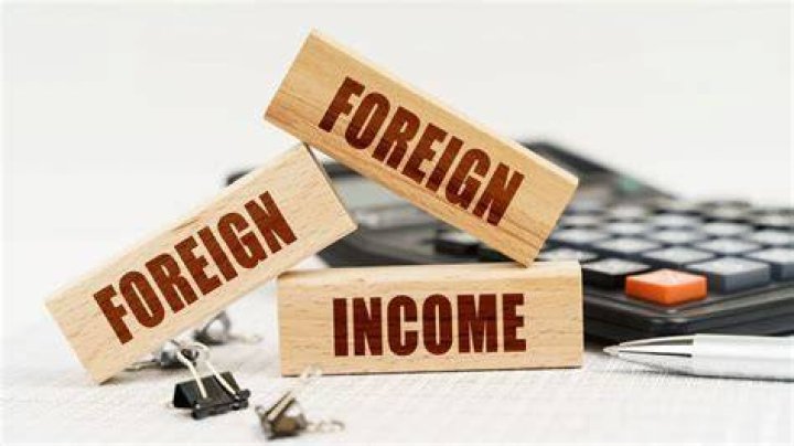How do you report foreign currency income?